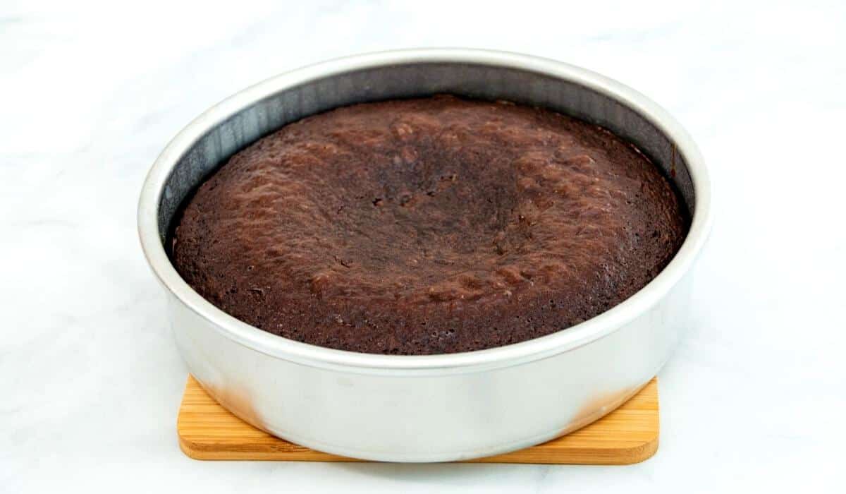 Chocolate cake that is sunk in the middle in a pan.