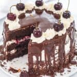 chocolate cherry cake with slice cut out on a plate