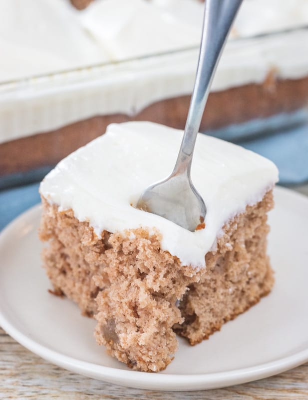 fork in an apple cake on a plate