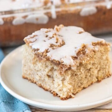 slice of apple crumb cake on a cream plate