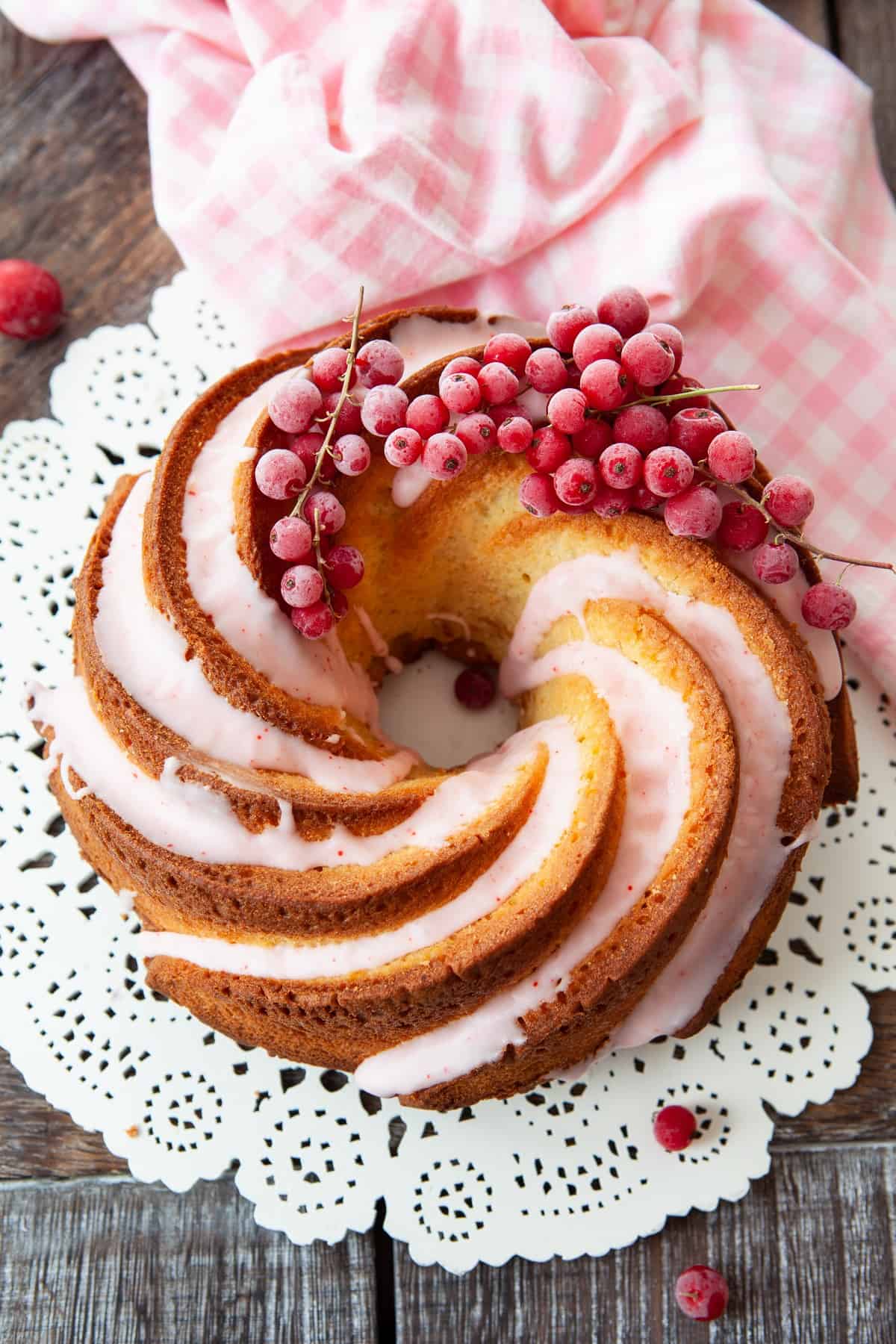 Top view of cake with glaze and berries.