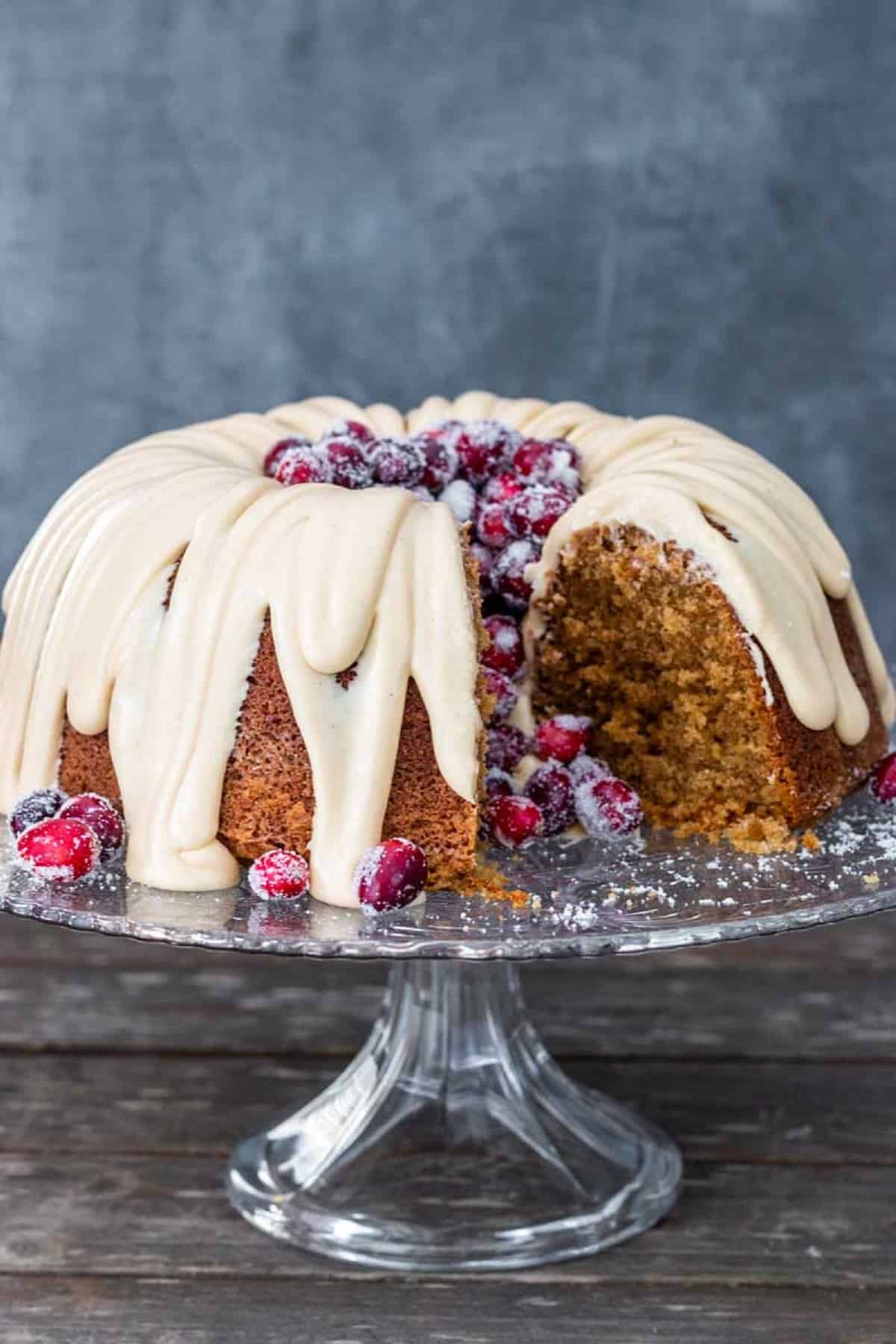 Spice cake with glaze and cranberries.