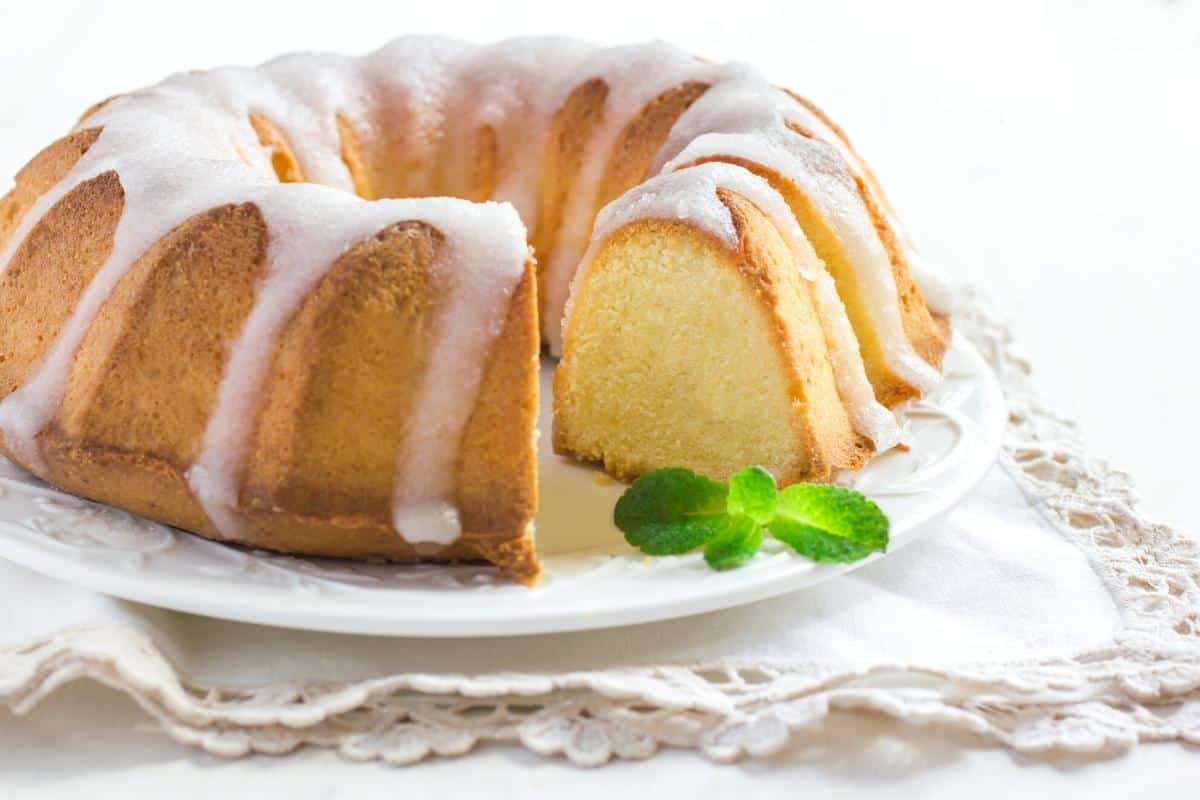Vanilla bundt cake on a white platter.