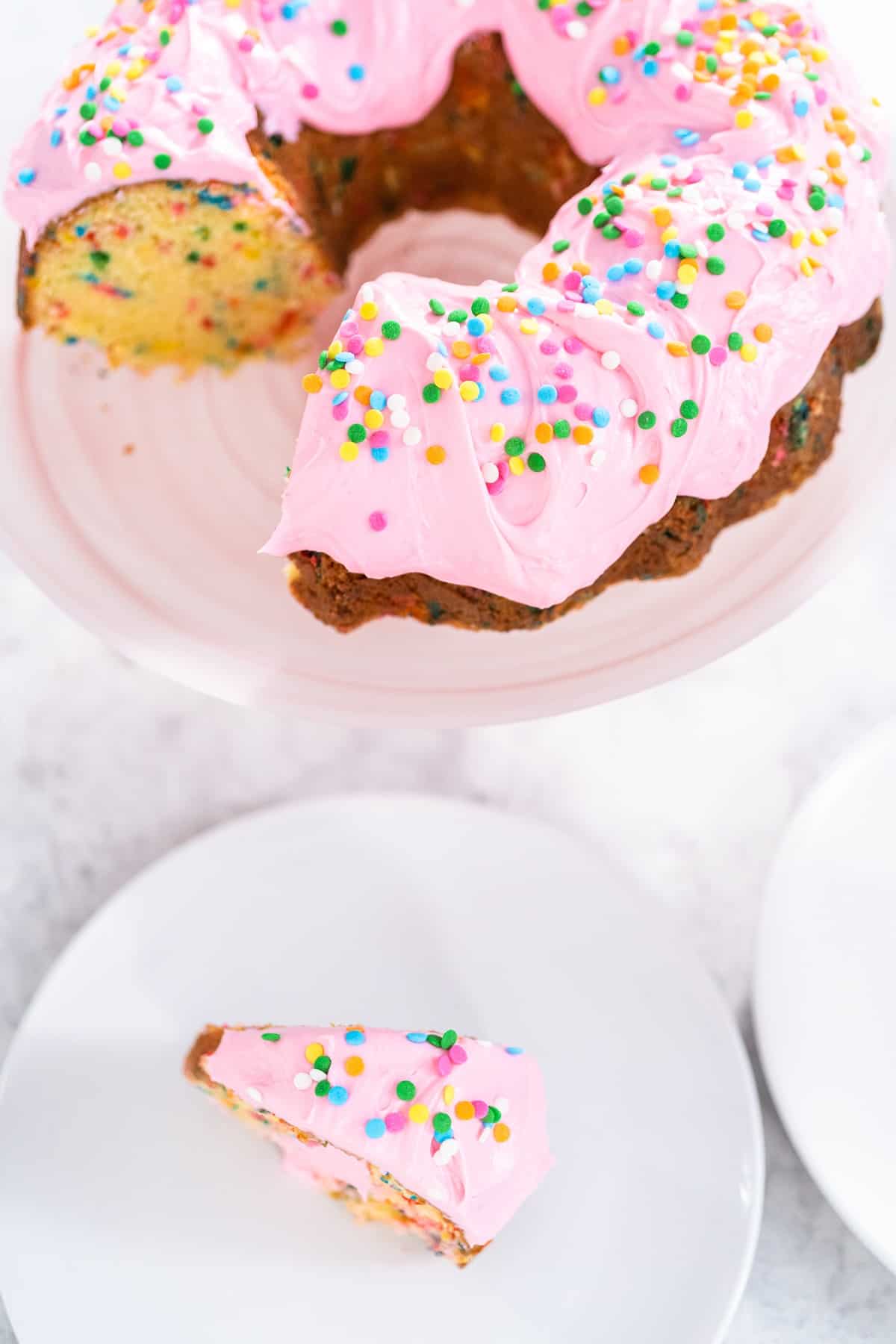 https://iscreamforbuttercream.com/wp-content/uploads/2022/01/bundt-cake-with-pink-frosting.jpg