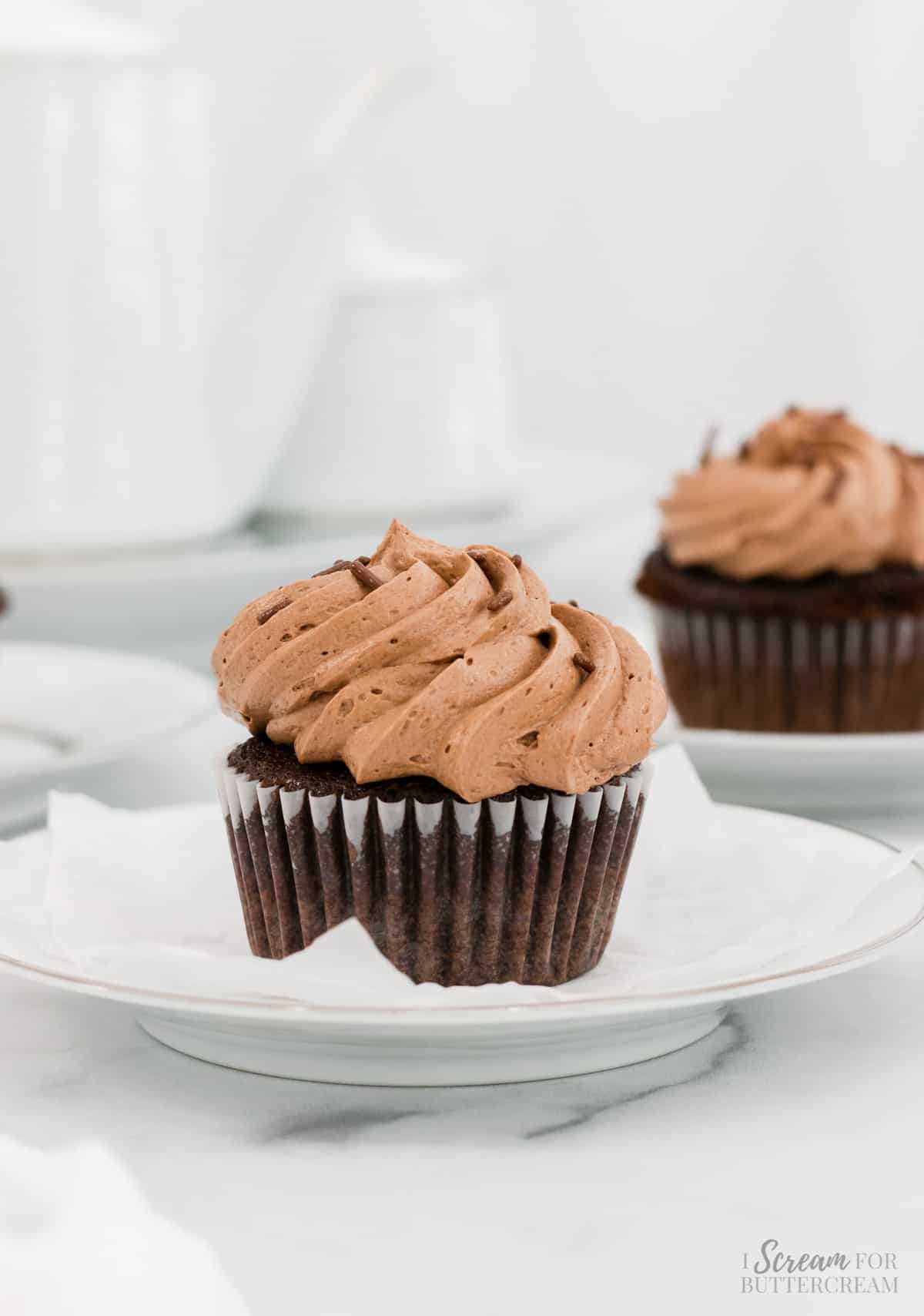 Image of chocolate mocha cupcakes on white plates.
