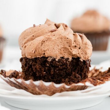 Close up of cut coffee cupcake with icing.