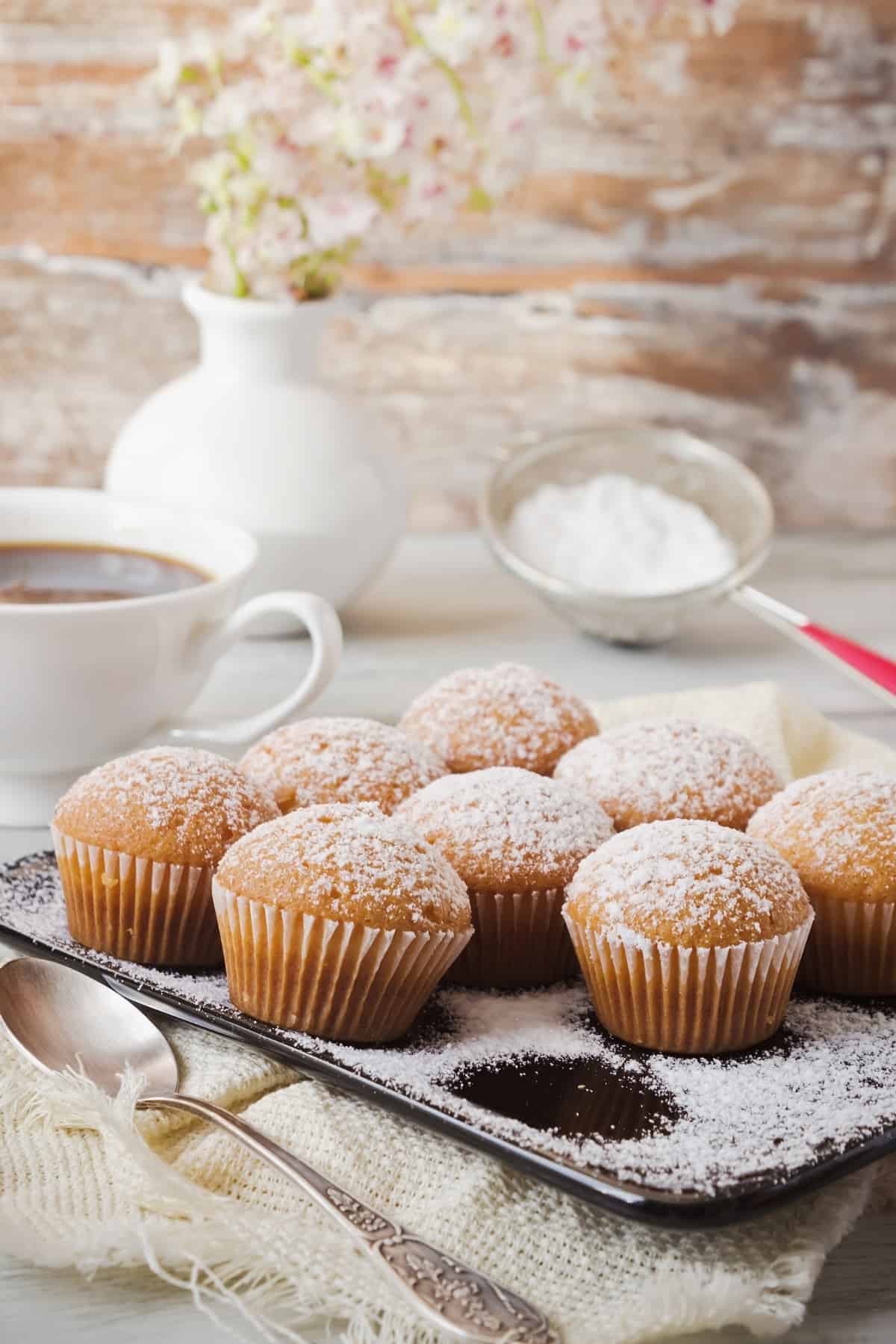 Powdered sugar on cupcakes.