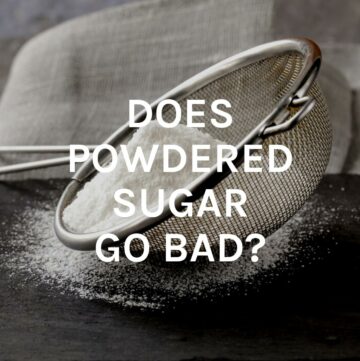 Background of powdered sugar with text.