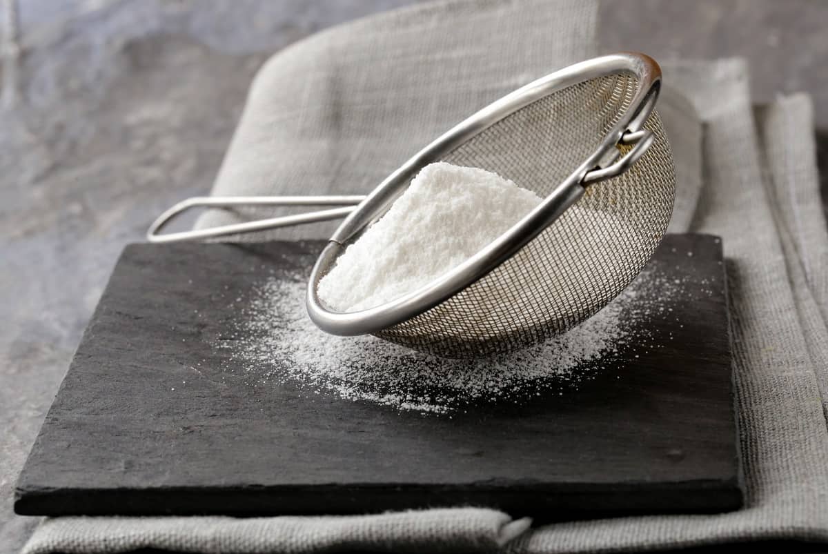 Powdered sugar in a sifter.