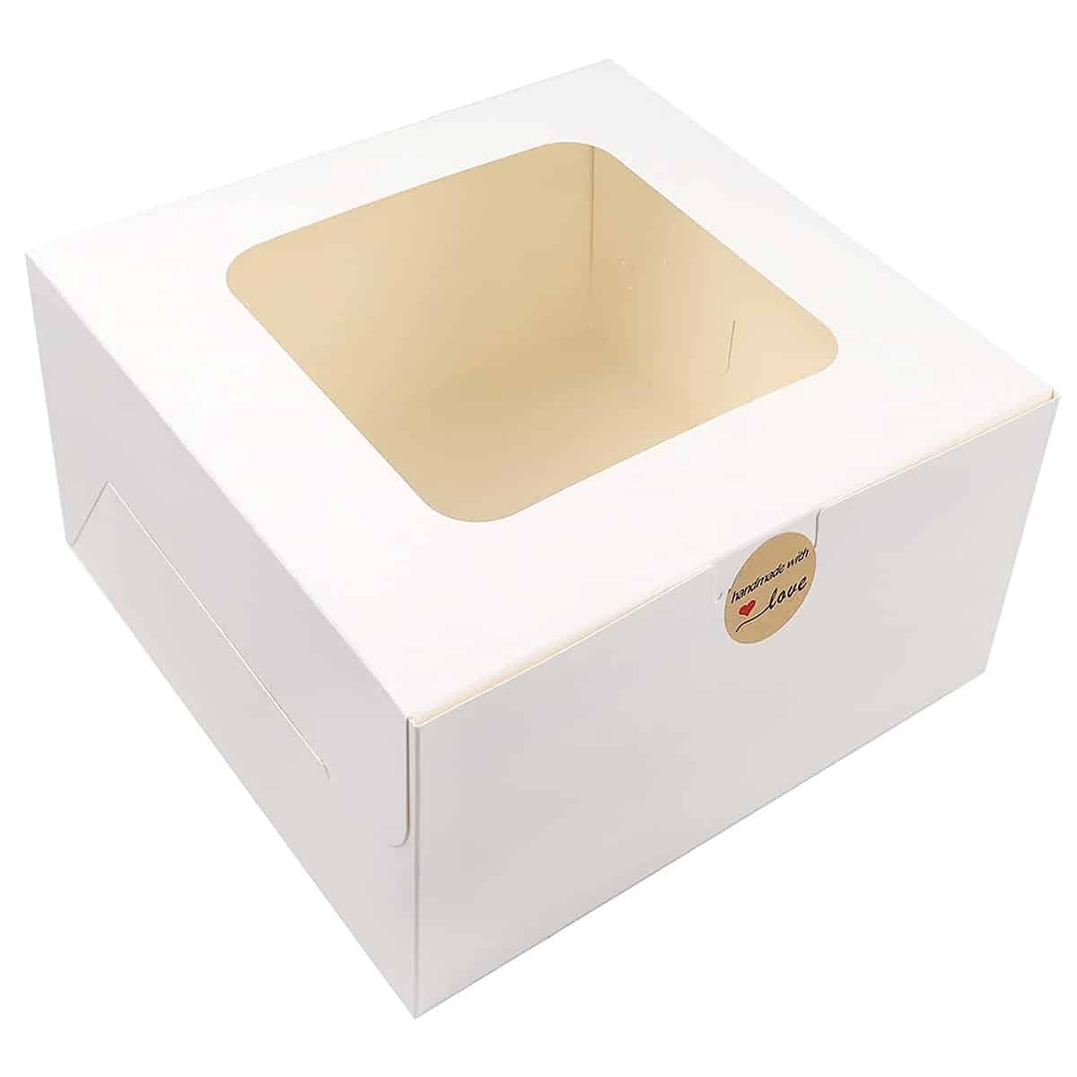 Image of white cake box with a sticker.