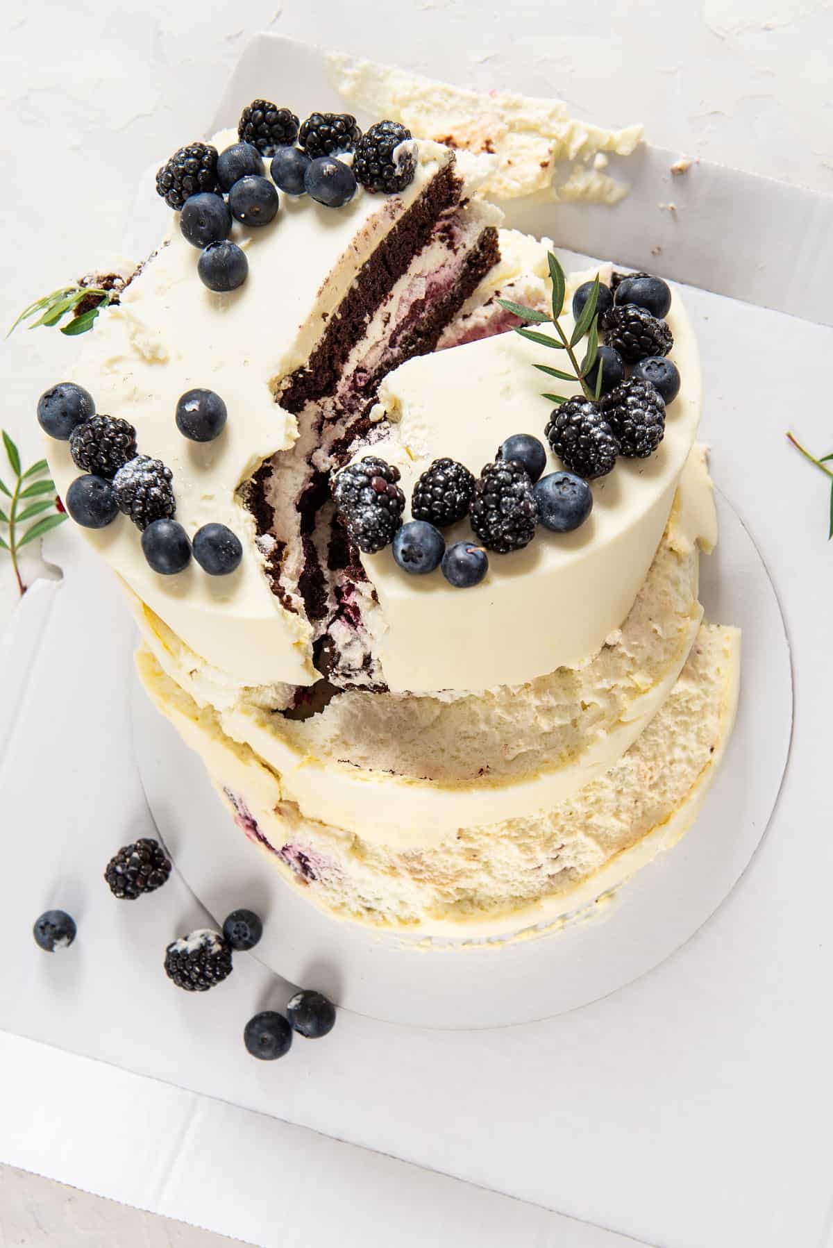 Image of vanilla cake with blueberries with split down the middle.
