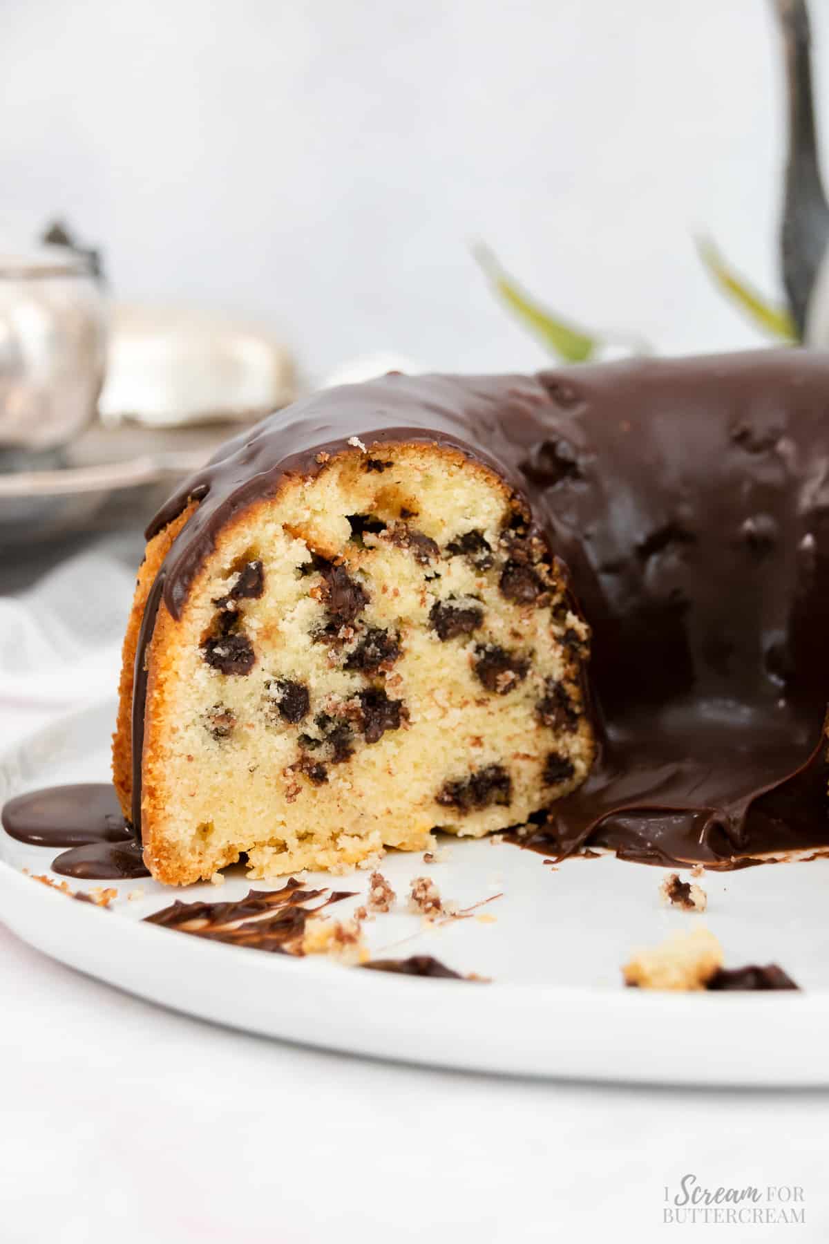 View of cut bundt cake with chocolate glaze.