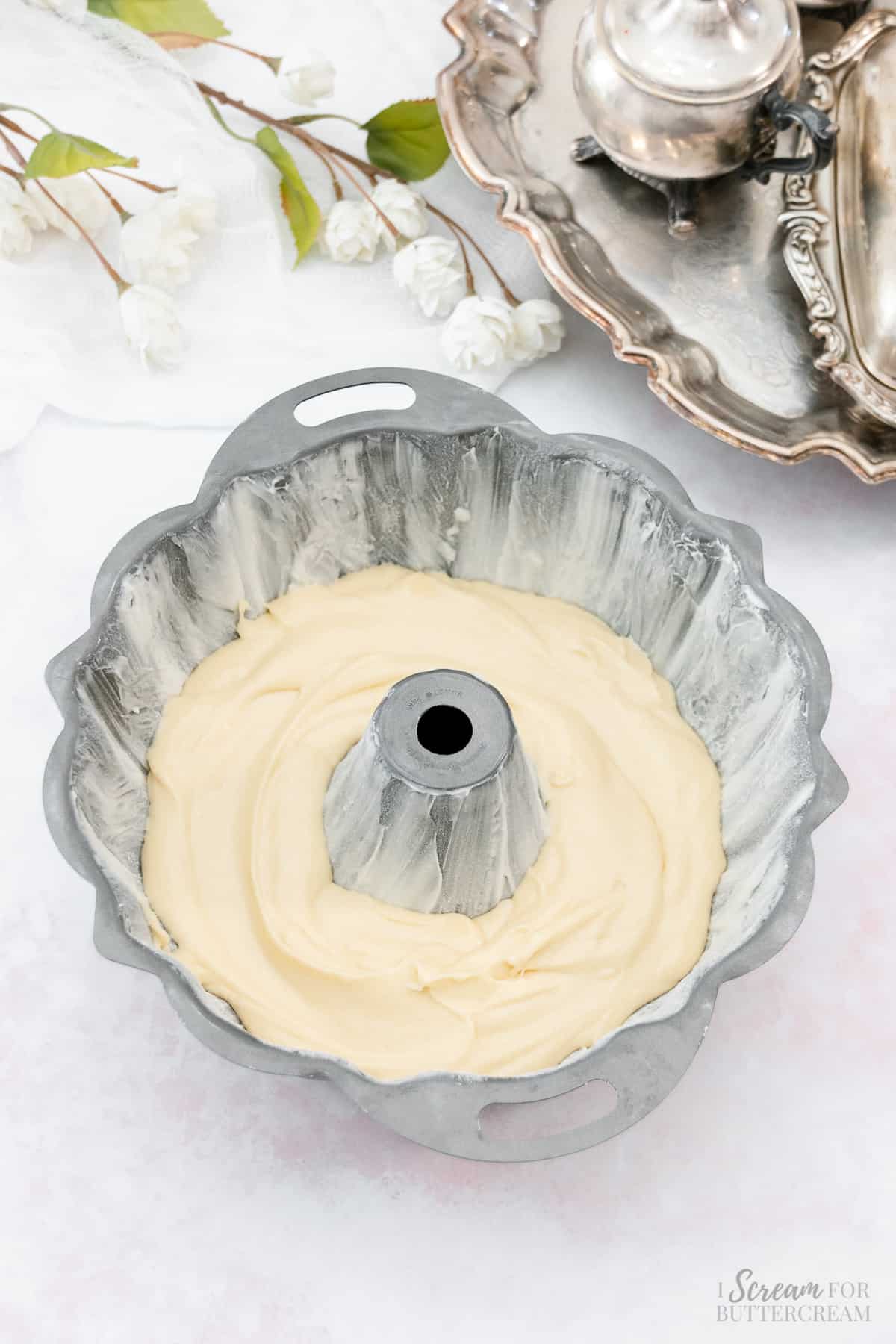 Bundt pan with only a third of the batter added.