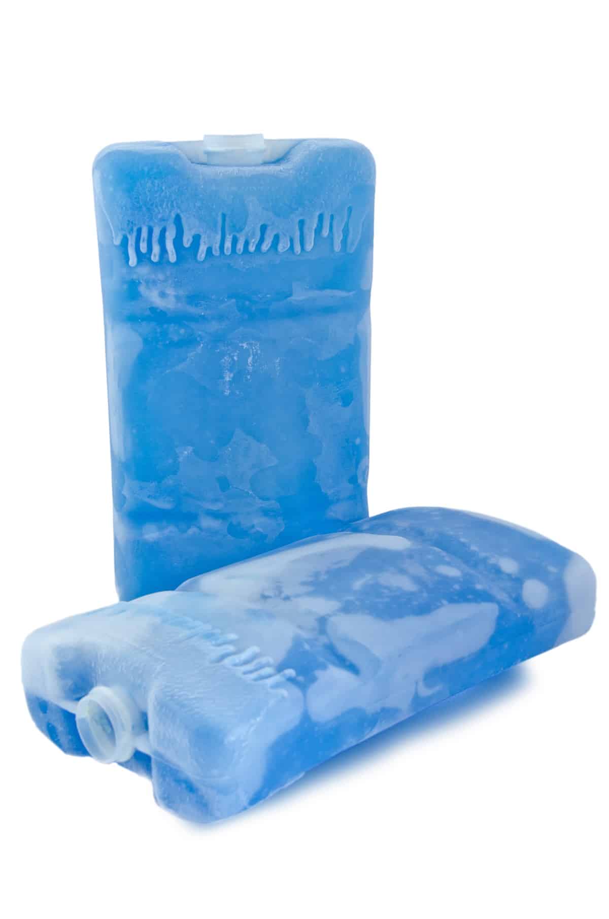 Blue ice packs with one laying down.