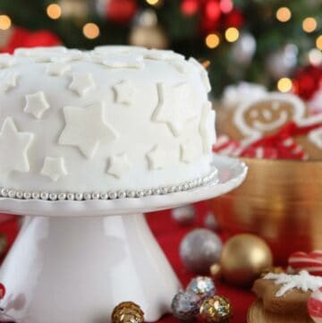 White christmas cake with christmas coolies.