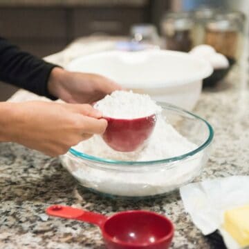 Bowl with flour and measuring cup.