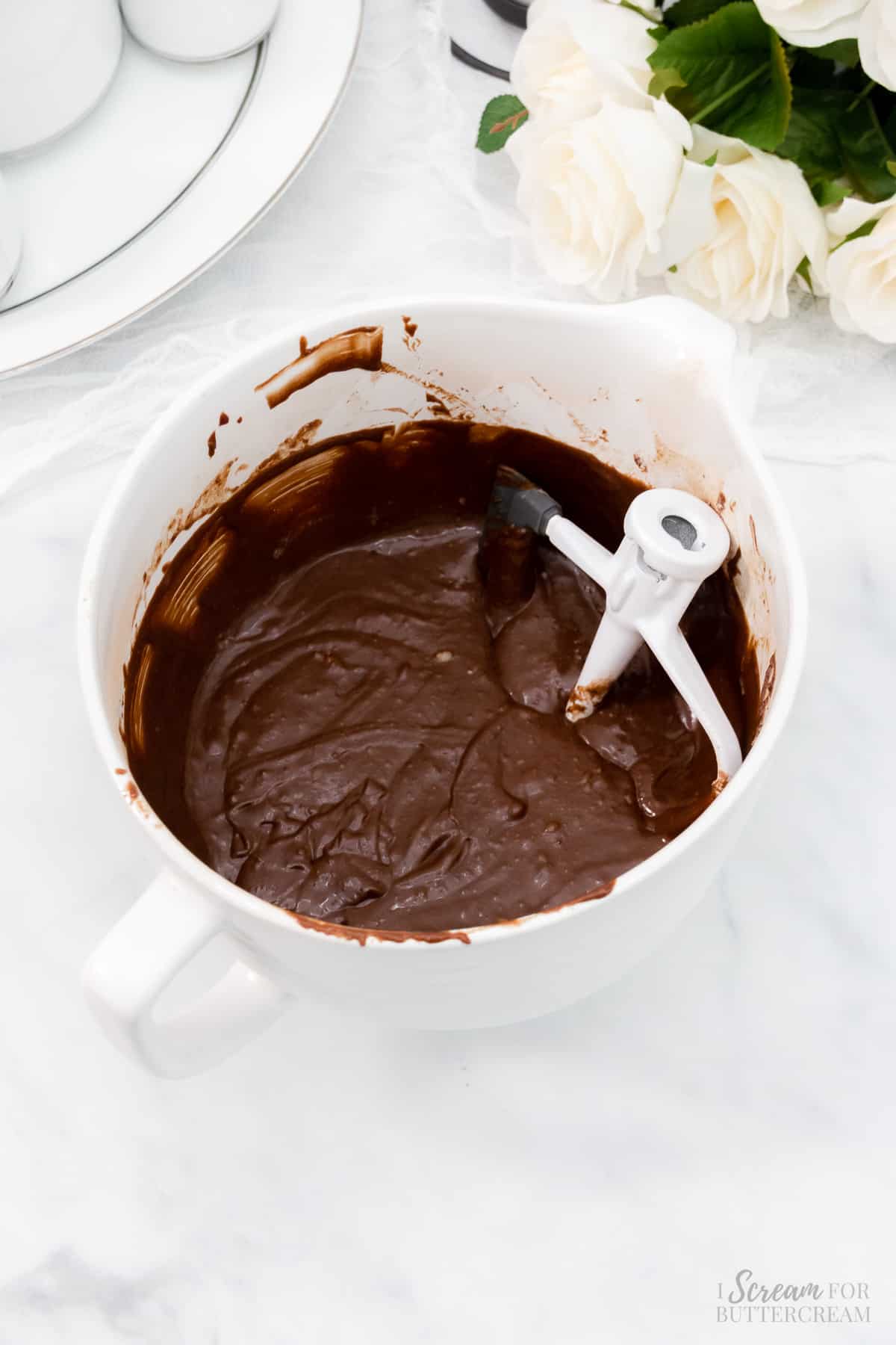 Chocolate cake mix in a white mixing bowl.