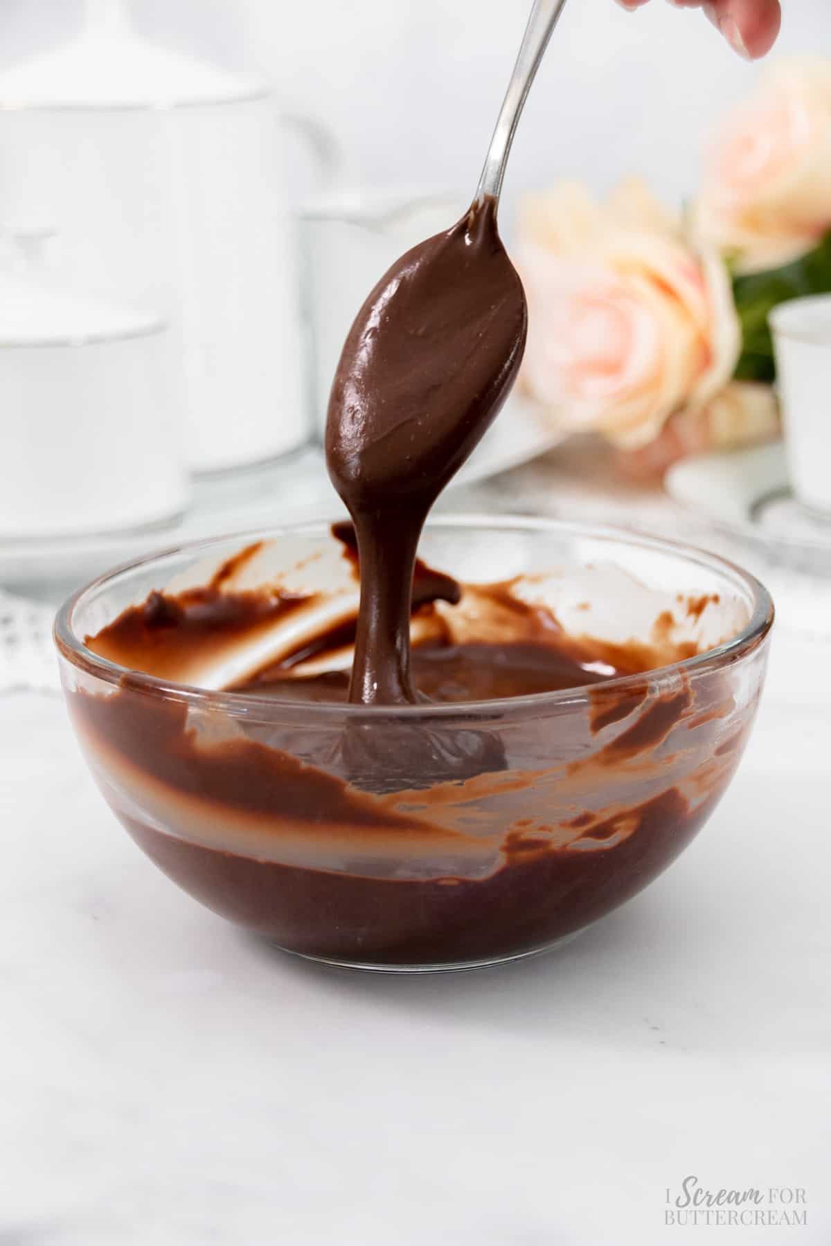 Chocolate glaze spooned into bowl.
