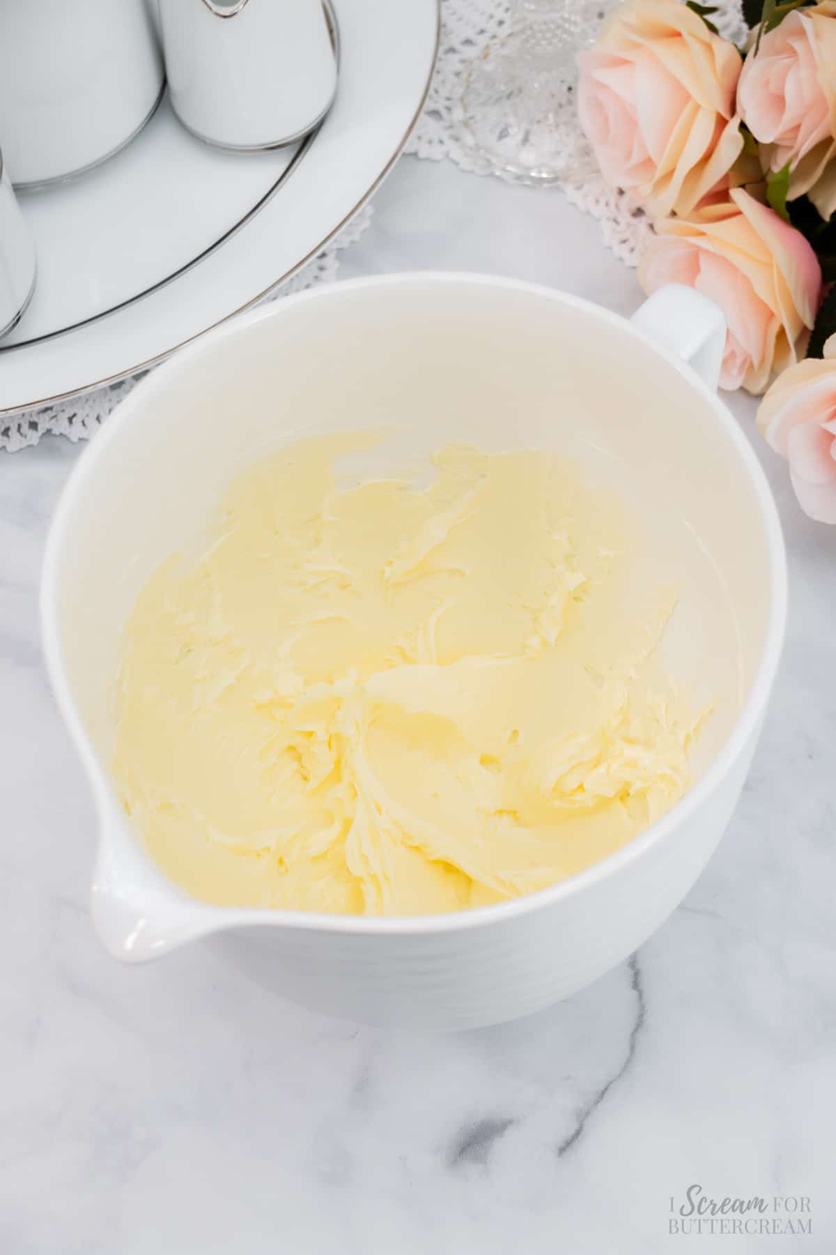 Whipped butter in a large mixing bowl.