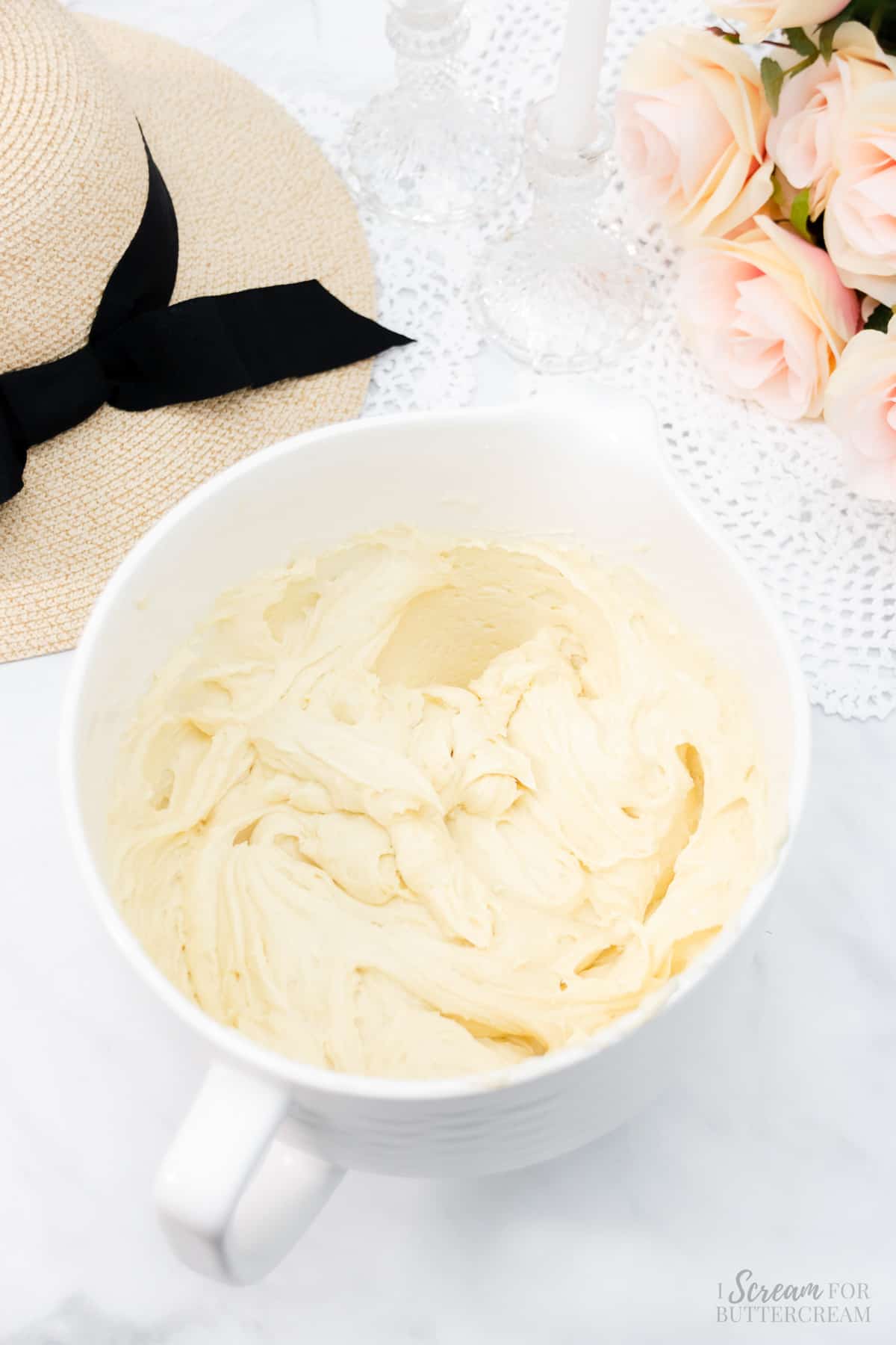 Prepared vanilla cake batter in a large white mixing bowl.