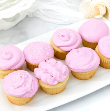 Featured image with eight decorated cupcakes with purple frosting.