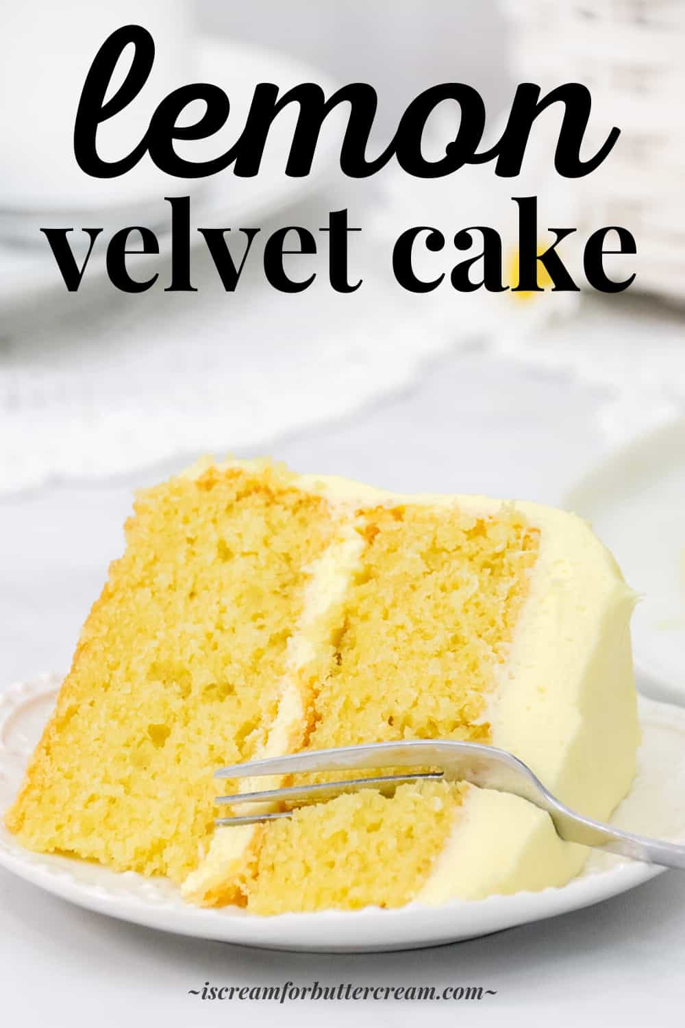 Pinterest image of lemon velvet cake with large slice of lemon cake with buttercream on a white plate with a fork.