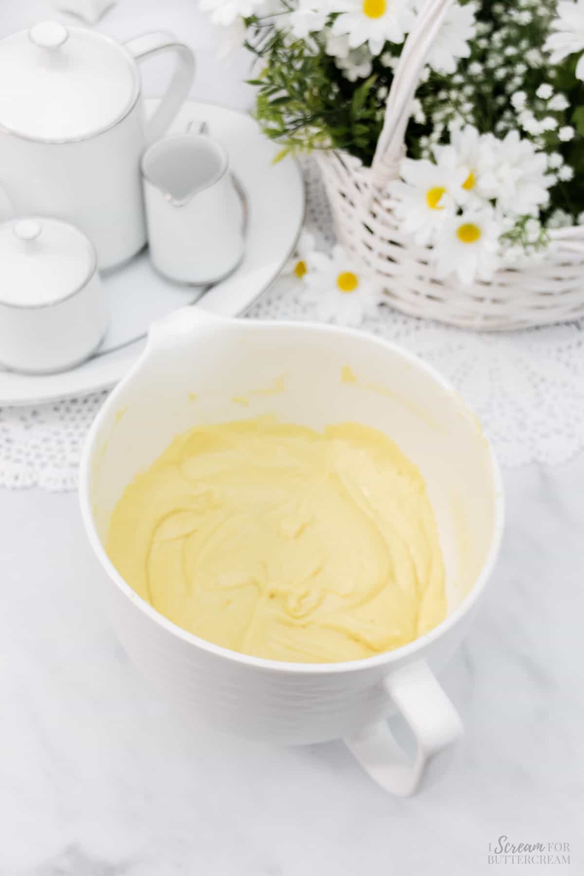 Lemon cake batter in a large white mixing bowl.