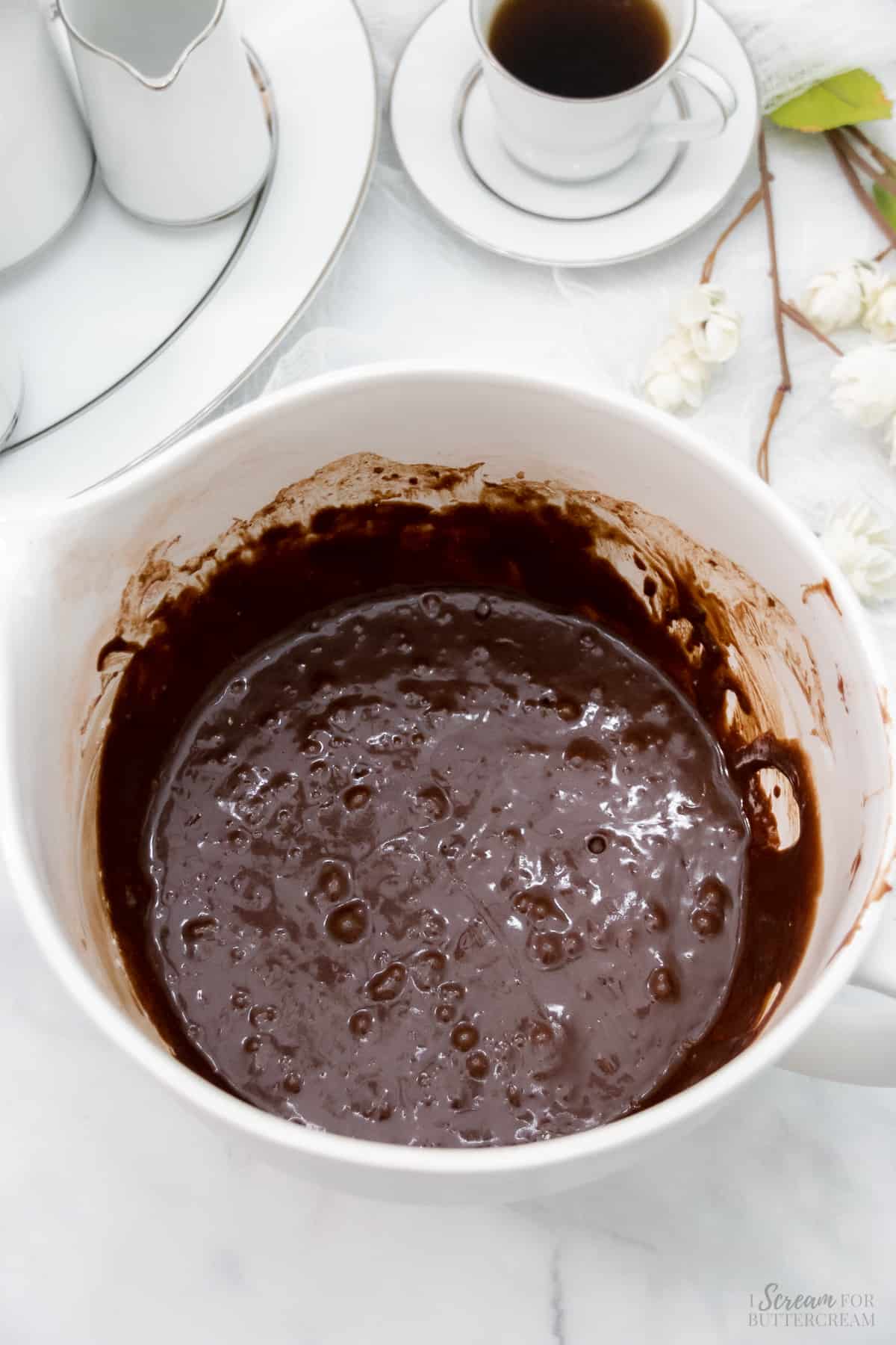 Chocolate cupcake batter in a large white mixing bowl.
