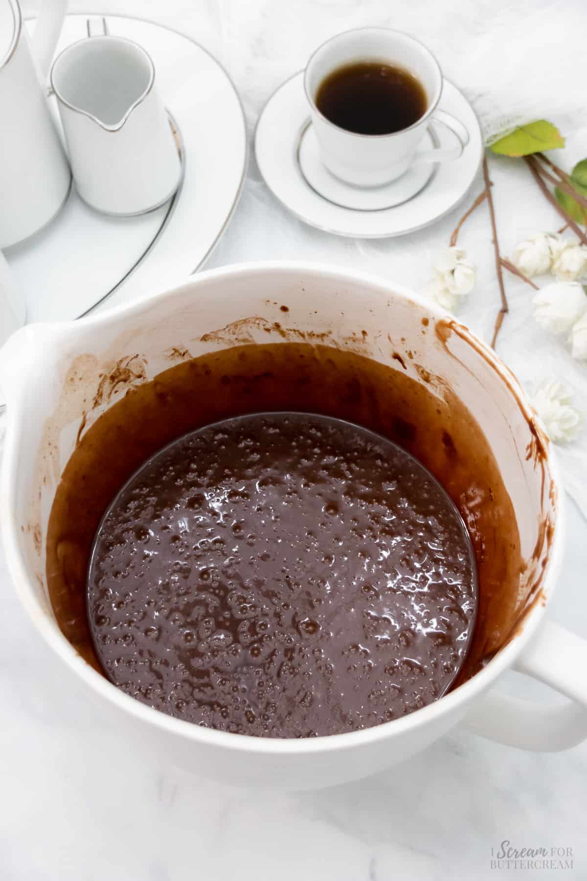 Chocolate cake batter in a large white mixing bowl.