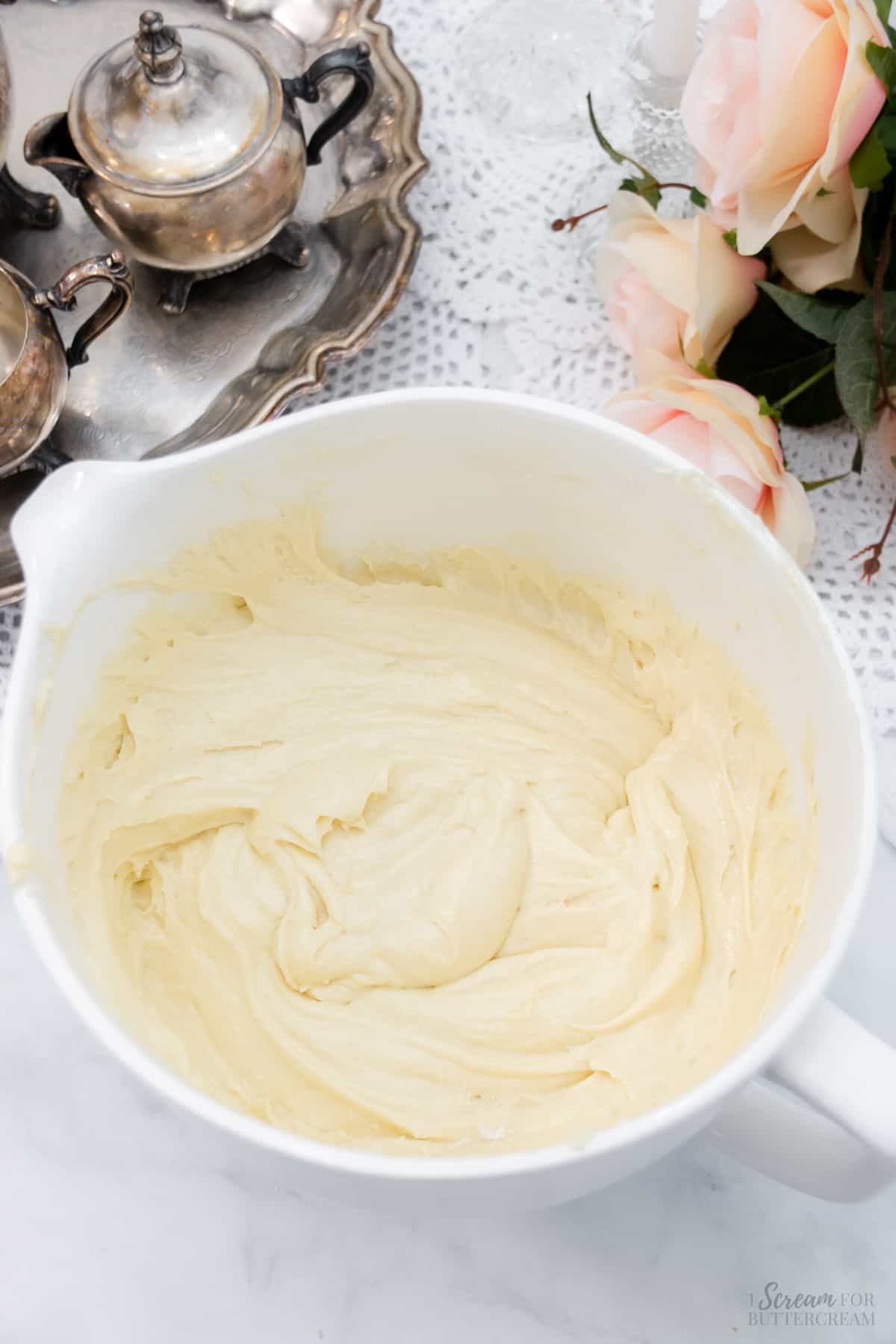 Final vanilla cake batter mixed in a white mixing bowl.