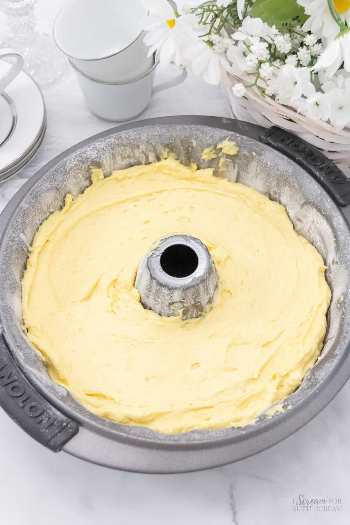 Lemon cake batter in a bundt cake.