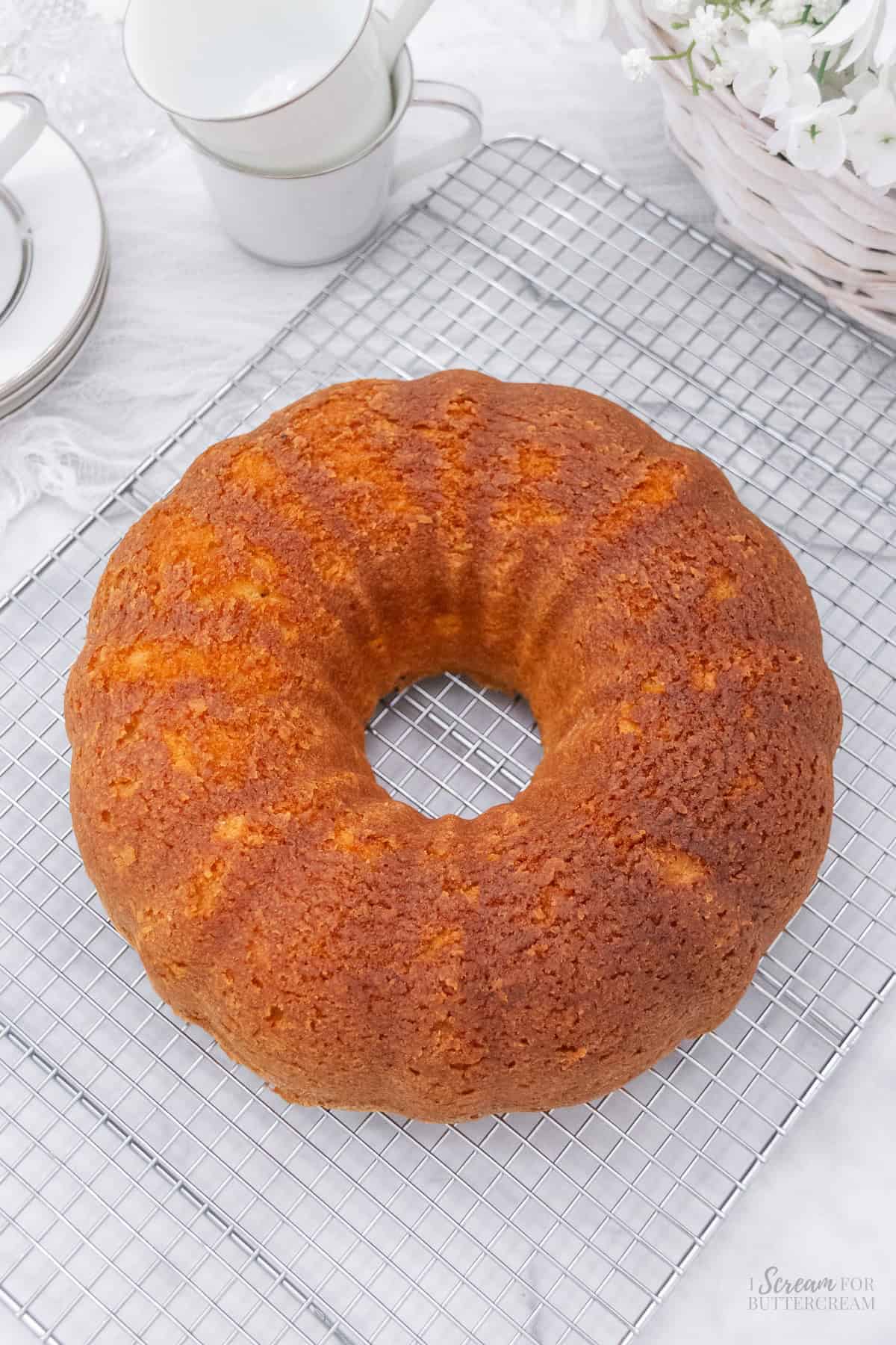 Top view of baked bundt cake on a cooling rack.