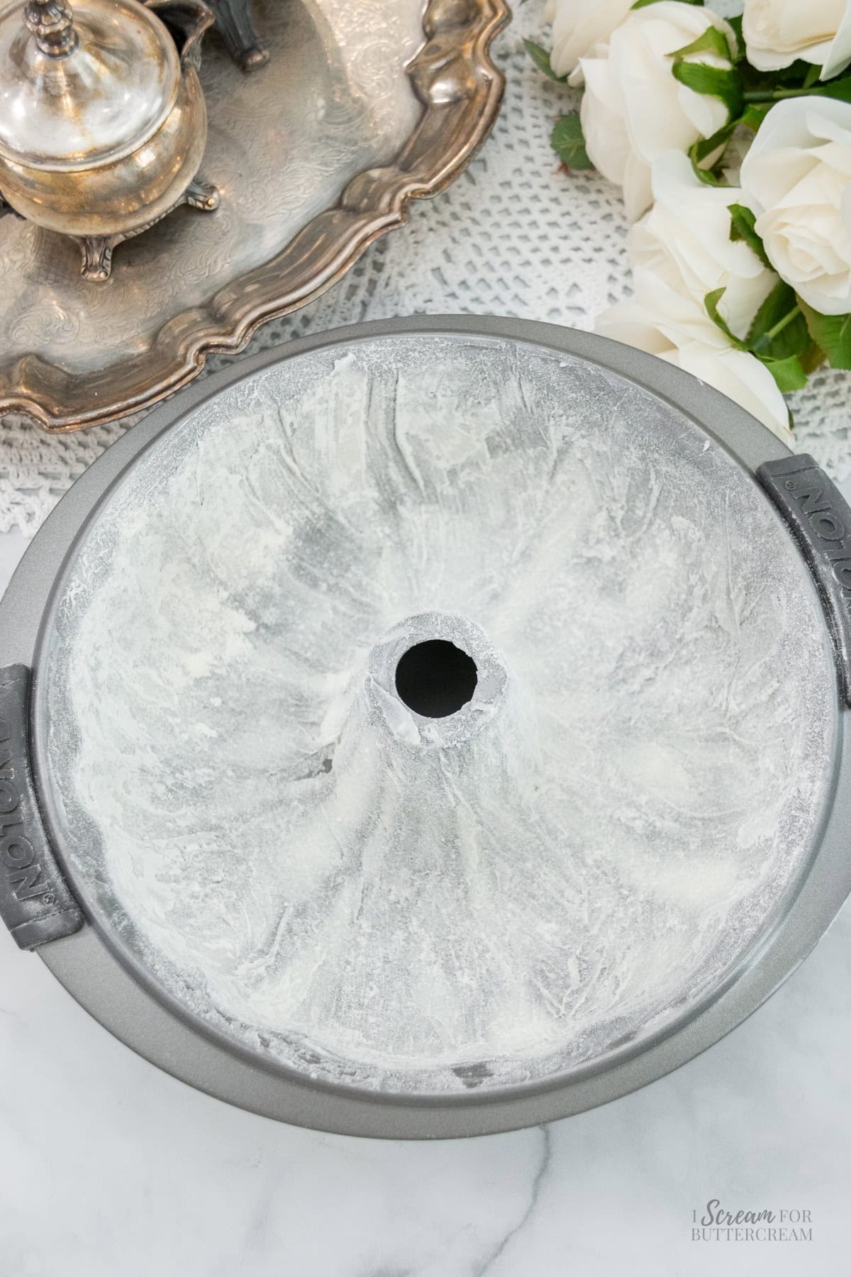 Bundt pan coated with flour and shortening, ready for cake batter.